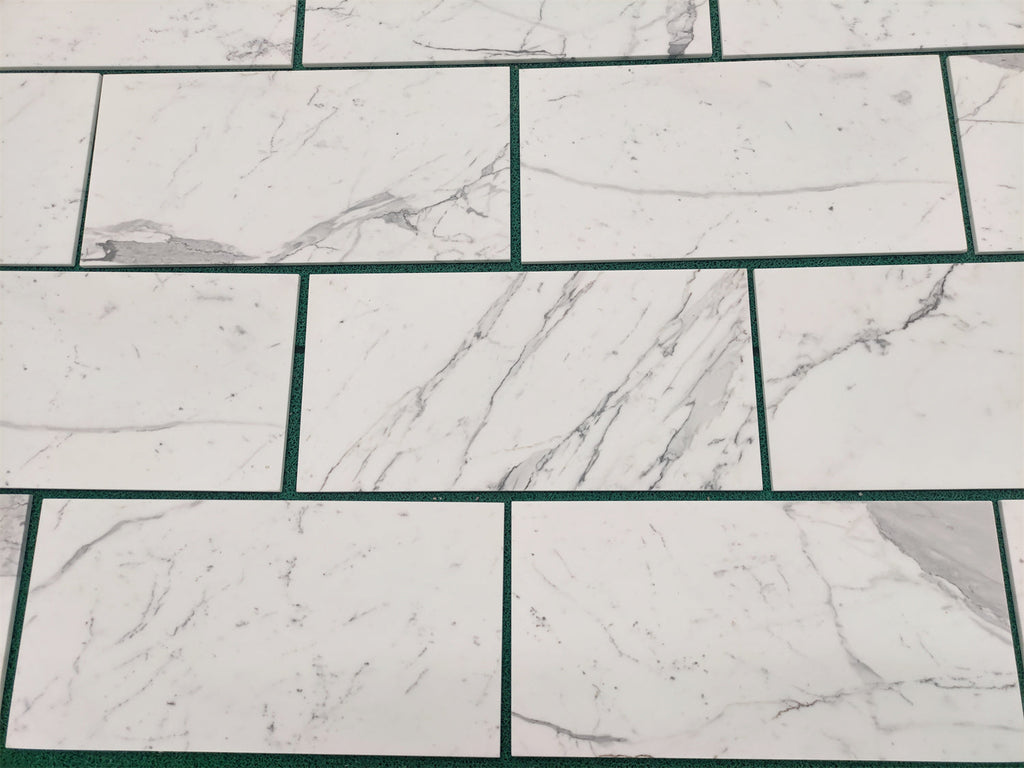 White marble-patterned tiles from Statuary Statuario White 4X12 Italian Marble collection