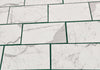 White marble-patterned rectangular tiles from Statuary Statuario White 4X12 Italian marble collection