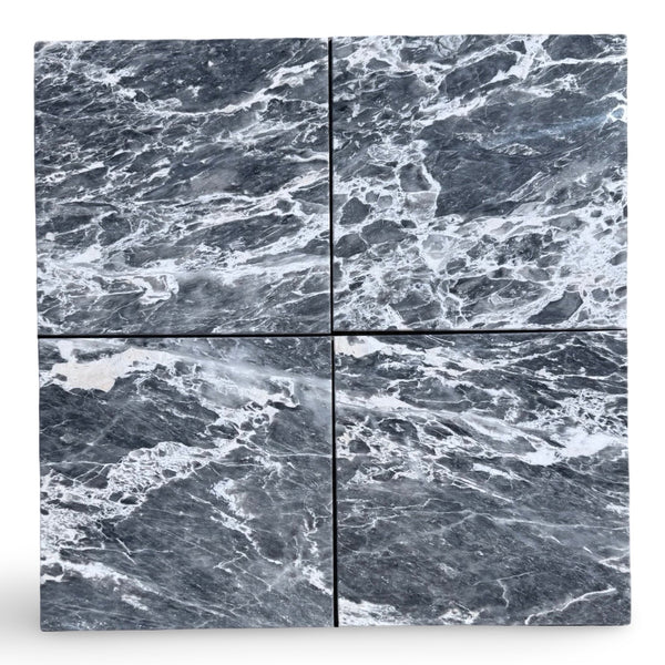 Four polished Storm Gray Marble 12x12 tiles with white veining for elegant flooring