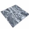 Four polished Storm Gray Marble 12x12 tiles in dark gray and white tones