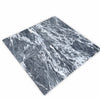 Four polished Storm Gray Marble 12x12 tiles in dark gray and white tones
