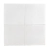 Four white square Thassos Greek marble tiles showcasing a honed finish