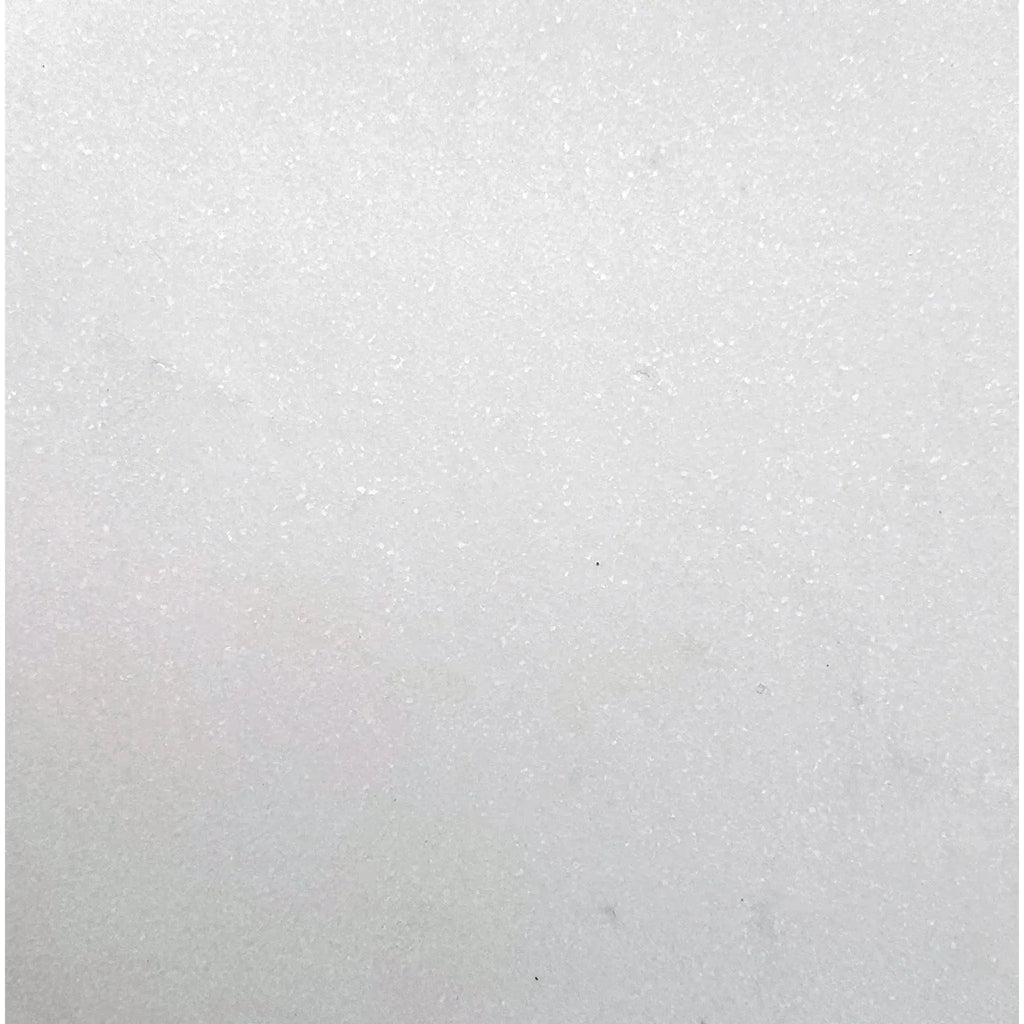 White textured surface of Thassos White Marble 12X12 Honed Tile displayed for sale