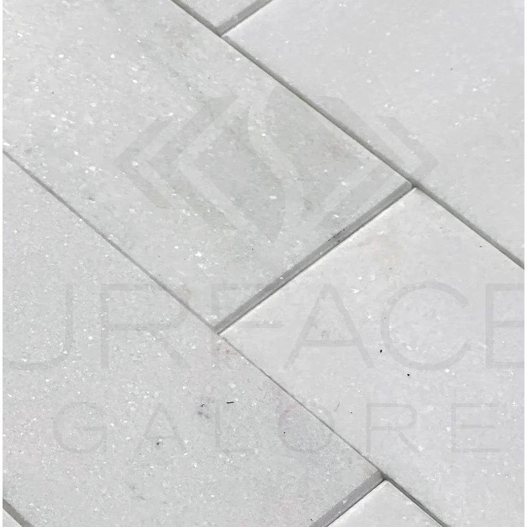 White rectangular tile pattern of Thassos White Marble 3X6 polished tile on display
