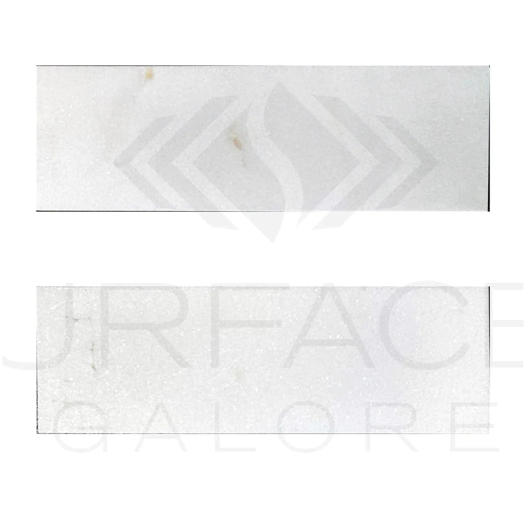 Two rectangular Thassos White Marble tiles displayed for sale, polished and standard quality