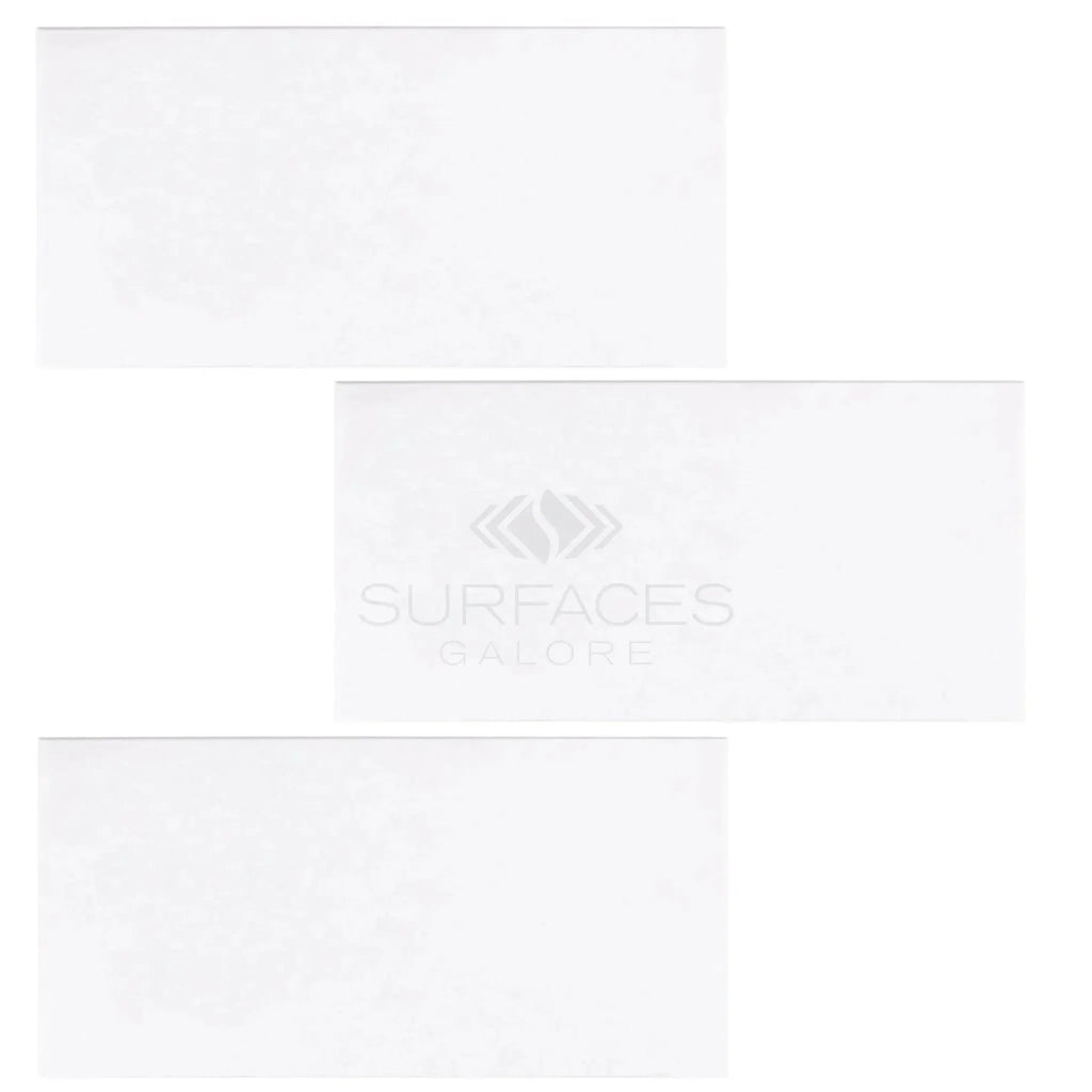 Three white rectangular tiles of Thassos White 12X24 Marble Polished or Honed