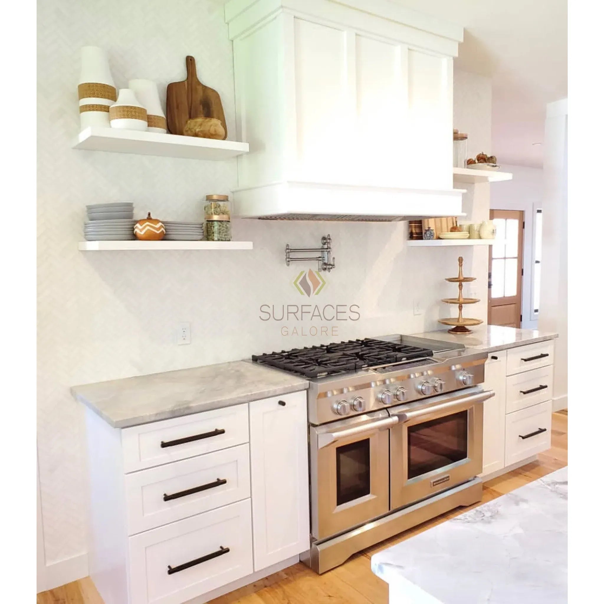 White kitchen featuring Thassos White 12X24 Marble Polished with stainless steel range