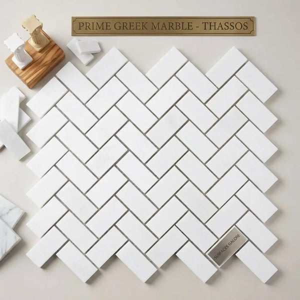 White prime greek marble thassos tiles arranged in a polished 1x2 herringbone mosaic pattern