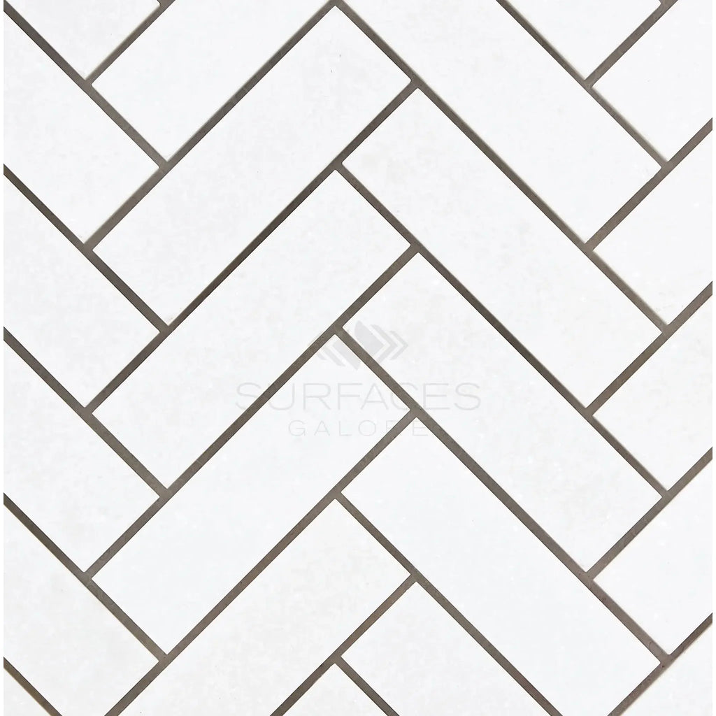 White herringbone tile pattern of Thassos White 1X3 Herringbone Mosaic Marble