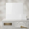 White square polished thassos marble 24x24 displayed on marble pedestal with smaller premium greek marble samples