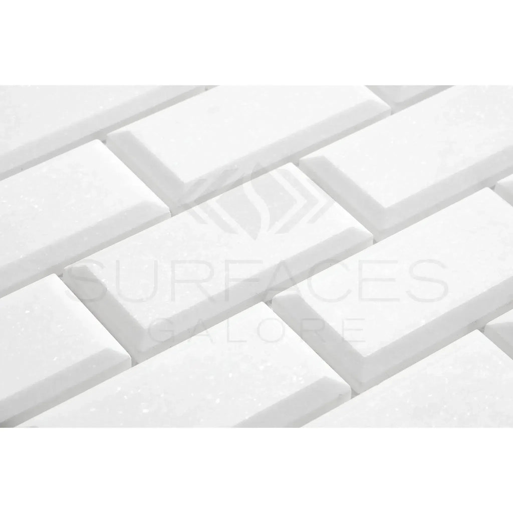 White beveled subway tiles in Thassos White 2X4 Deep-Beveled Brick Mosaic Marble