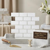 Thassos white 2x4 straight-edged brick mosaic marble tiles arranged in a classic white rectangular subway pattern