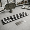 Black and white greek key pattern mosaic tile border in polished or honed thassos white marble with black accents