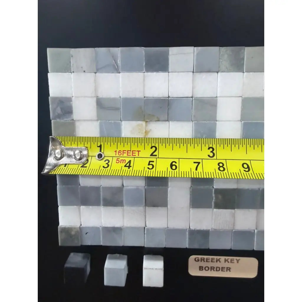 Gray and white marble mosaic tile panel with greek key border in thassos white polished or honed finish with blue-gray accents