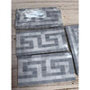 Gray and white marble mosaic tile panels featuring thassos white greek key border with blue-gray accents polished or honed