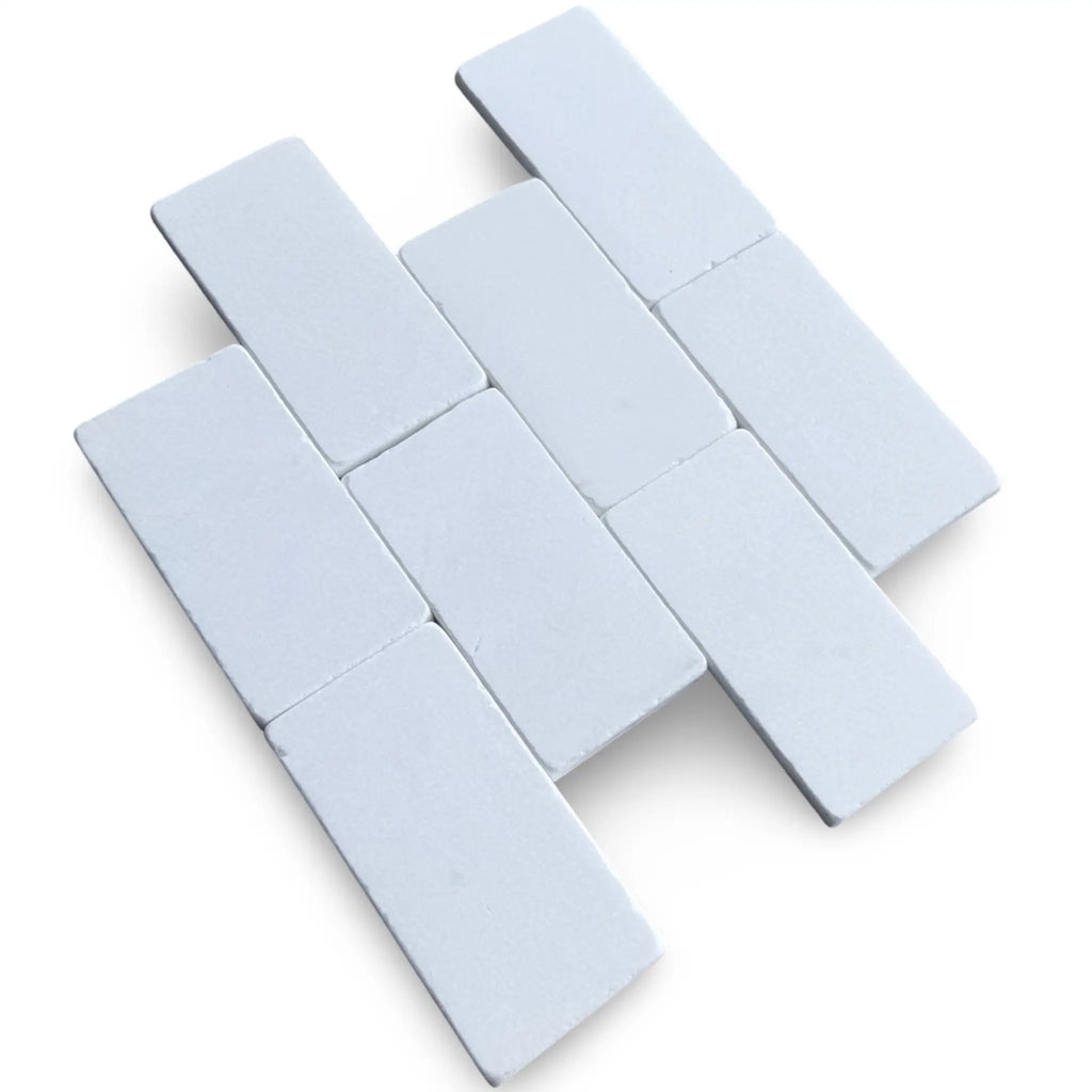 White rectangular magnets showcasing Thassos White 3X6 Marble Tumbled design