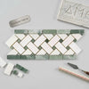 A sleek Thassos white and ming-green marble mosaic tile with a polished herringbone basketweave border pattern