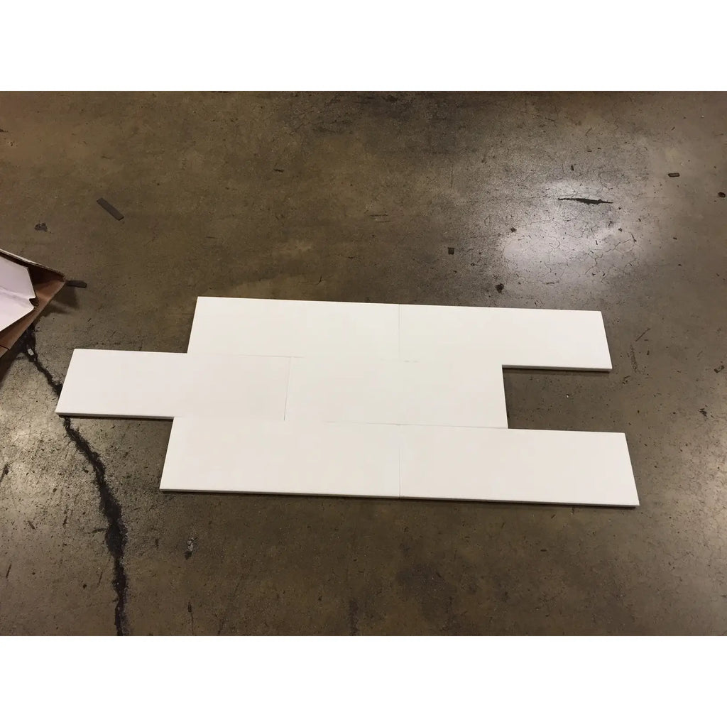 White interlocking foam pieces suitable for Thassos White 4x12 Marble installations