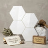 White hexagonal tiles of thassos white premium greek marble arranged in a geometric pattern for mosaic use