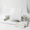 A sleek polished Thassos White 6x6 marble tile sample with glossy white Greek marble and subtle veining