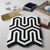 Black and white geometric mosaic marble tile with bold interlocking pattern in Thassos White Berlinetta Design polished or honed
