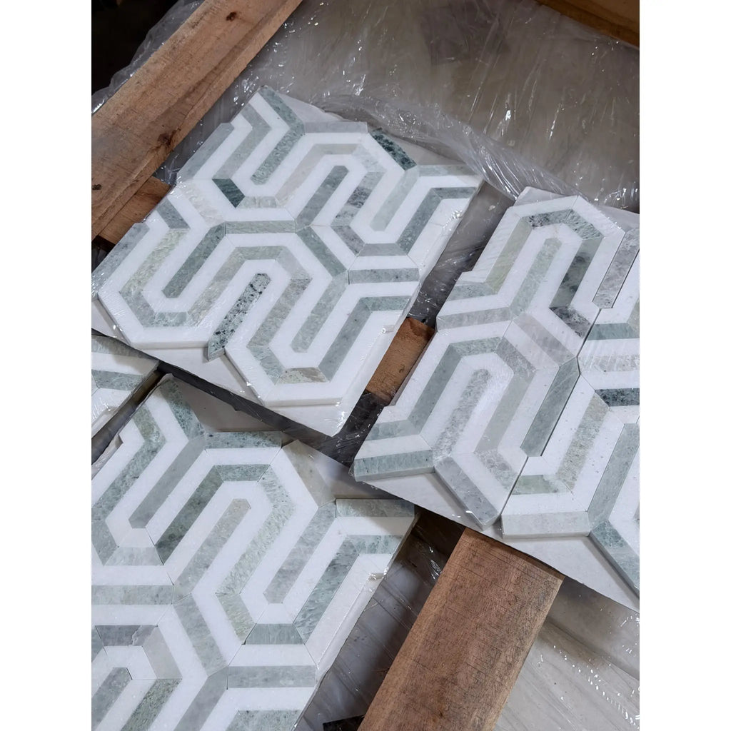 White and gray geometric mosaic marble tiles with raised interlocking pattern in thassos white berlinetta design