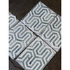 Geometric patterned tile squares from Thassos White Berlinetta Mosaic with Ming-Green accents