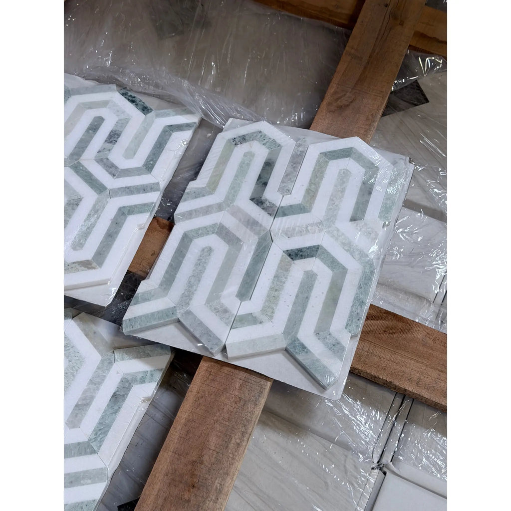 Thassos white Berlinetta design mosaic marble tiles in white and gray with 3d geometric pattern wrapped in clear plastic