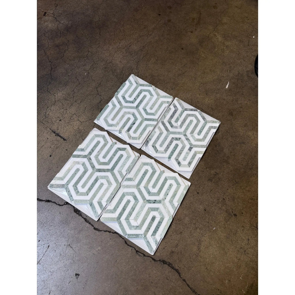 Geometric patterned tiles from Thassos White Berlinetta Design with Ming-Green accents