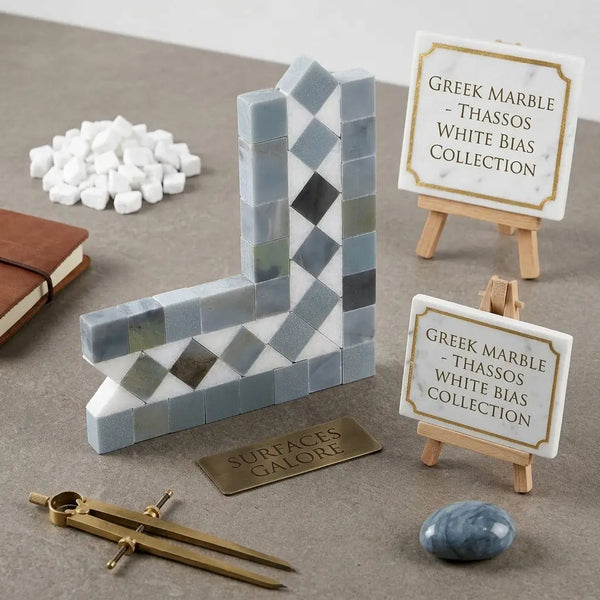 A sleek l-shaped Thassos white bias border corner bookend with blue-gray interlocking Greek marble tiles in diamond pattern