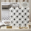 White greek marble mosaic tile with black circular accents in an elegant repeating floral pattern polished or honed finish