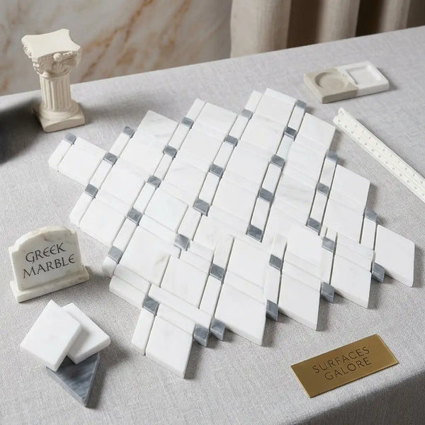 White greek marble mosaic tiles with silver gray accents in a diagonal lattice pattern thassos white blue gray polished or honed