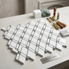 Thassos white lattice polished greek marble mosaic tiles in white and mink green arranged in a geometric pattern