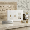 Thassos white marble double toggle duplex switch wall plate featuring a white double-gang cover with two toggles and one duplex opening