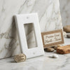 Thassos white marble single rocker switch plate with smooth polished surface and subtle veining for wall use