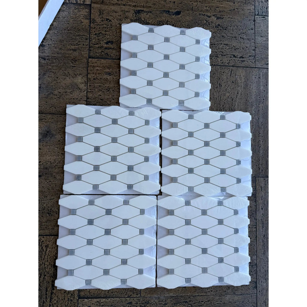 Thassos white octave white hexagonal marble mosaic tile panels with blue gray accents in polished geometric pattern