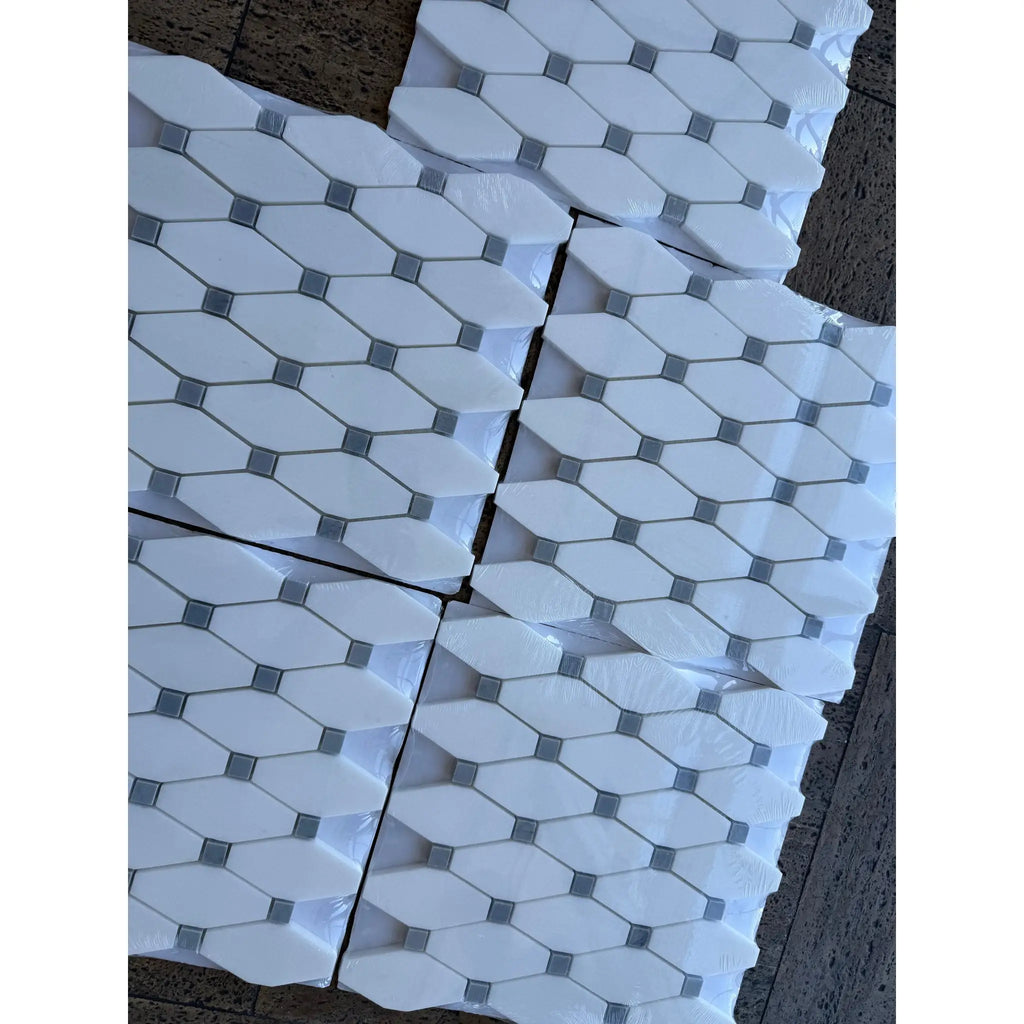 Thassos white octave long octagon mosaic marble tiles with blue-gray accent squares wrapped in clear plastic