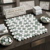 A thassos white penny-round mosaic marble tile pattern with alternating white carrara and sage green ming green circles