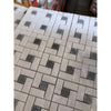 Thassos white pinwheel mosaic marble tile panel with polished white and dark gray woven pattern and blue-gray accents