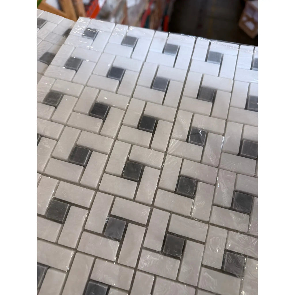 Thassos white pinwheel mosaic marble tile panel with polished white and dark gray woven pattern and blue-gray accents
