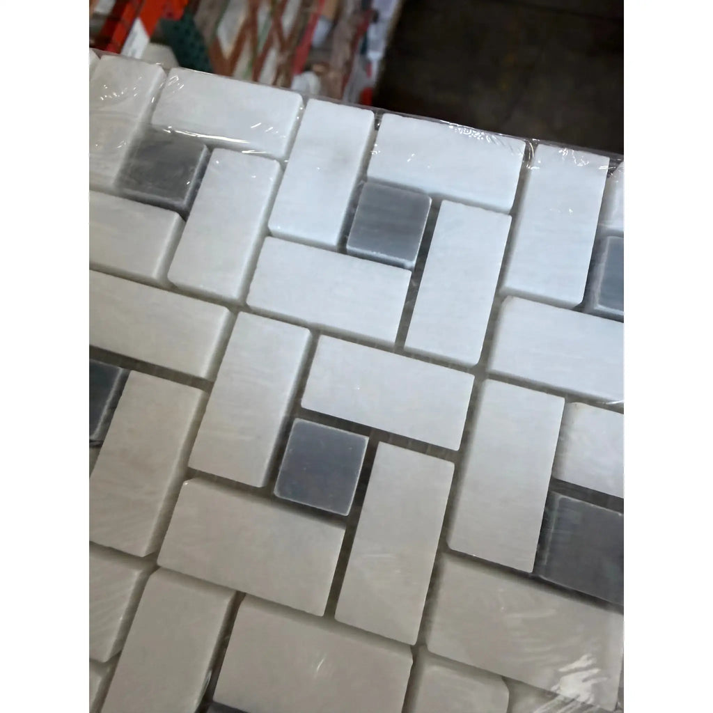 Thassos white pinwheel mosaic with blue-gray marble polished tiles in white and gray arranged in herringbone pattern wrapped in plastic