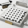 Thassos white triple-weave mosaic marble tile with black accents in woven pattern polished or honed finish