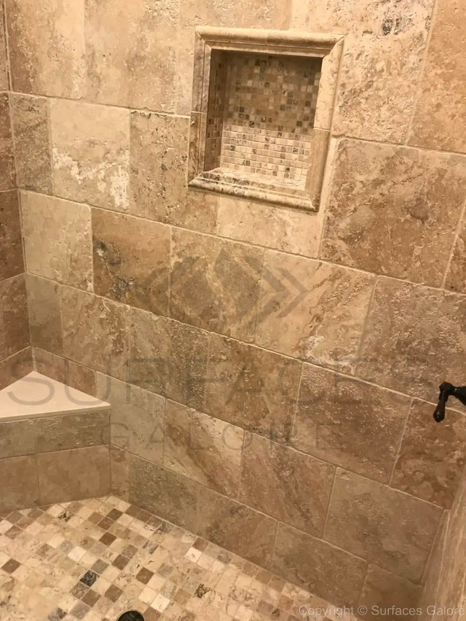 Tiled shower with niche.