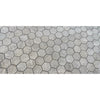 Tundra gray 2 inch hexagon marble mosaic with subtle veining and a matte honed finish on gray stone tiles