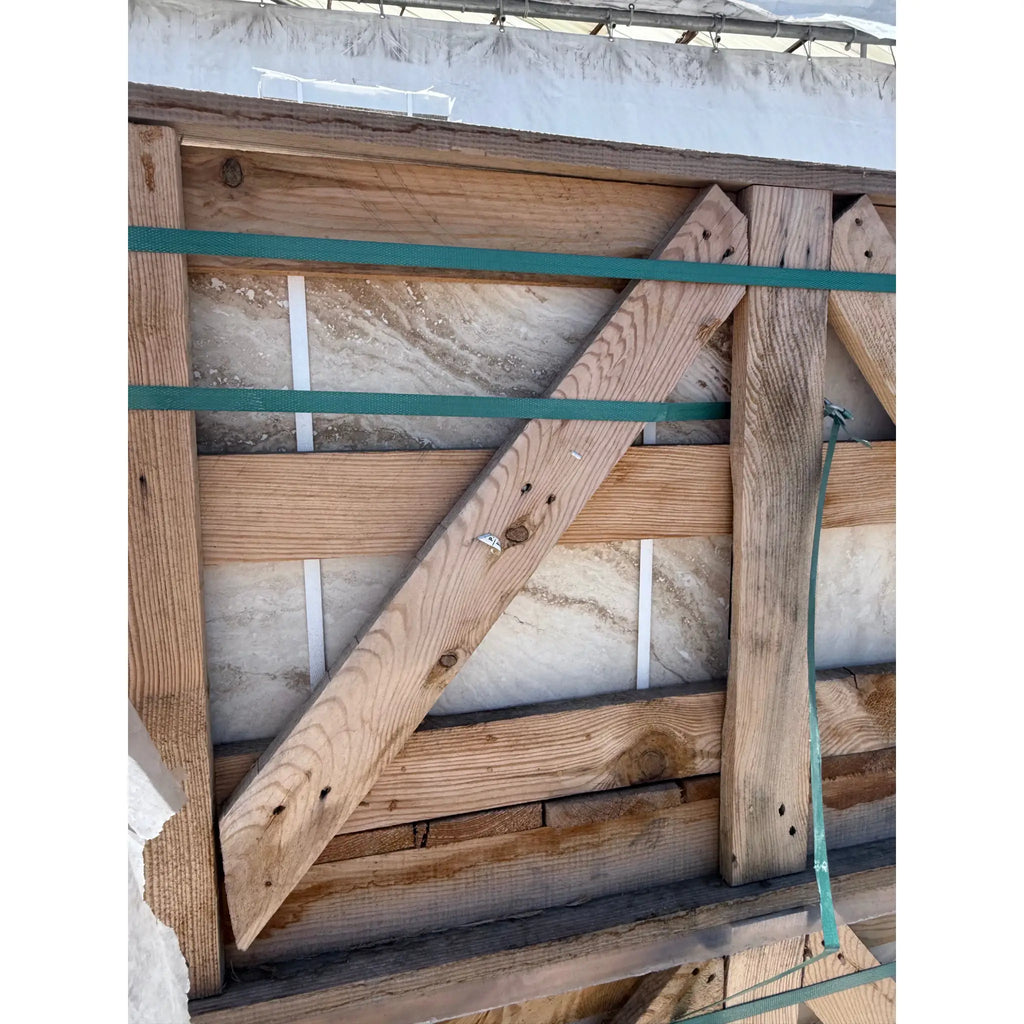 Wooden-framed stone slab from Valencia Travertine 18X18 Filled and Honed collection