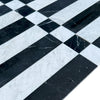 Black and white marble tile pattern of Veneto in Nero Marquina and Carrara White
