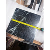 Verde Alpi empress green marble 12x12 polished tile in black with white veining measured by yellow tape measure