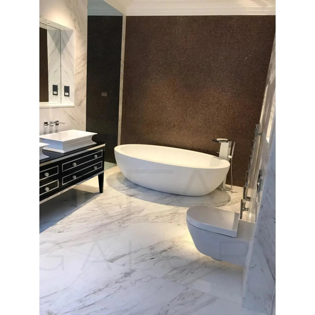 Modern white bathroom suite featuring Volakas Marble polished tiles 24X24 3/4 thickness