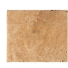 Beige travertine tile in Walnut Travertine 16X24, unfilled, brushed, and chiseled-edge