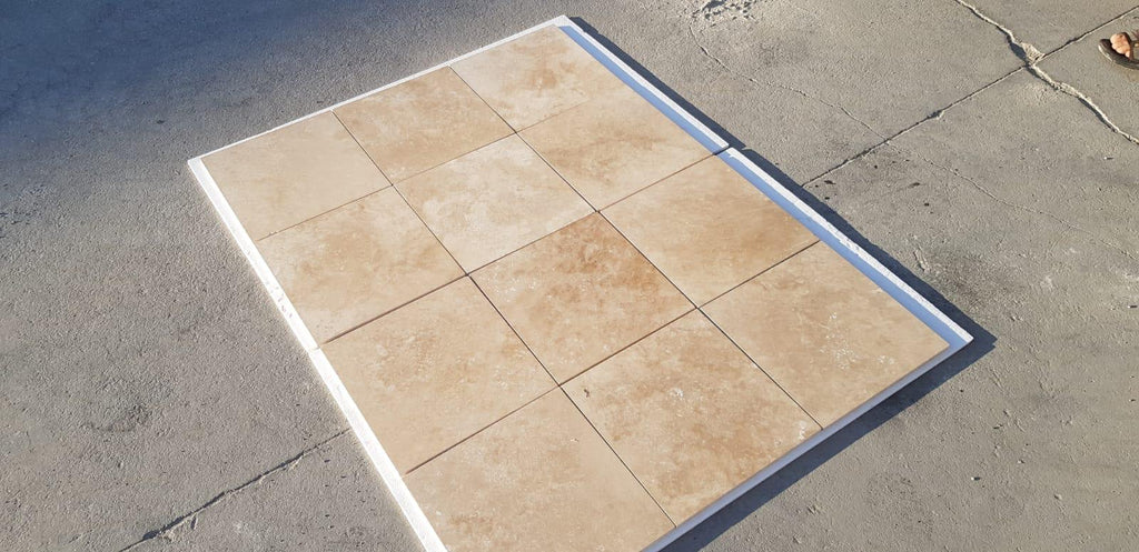 Beige Walnut Travertine 18x18 tile with white border and blue accents for flooring